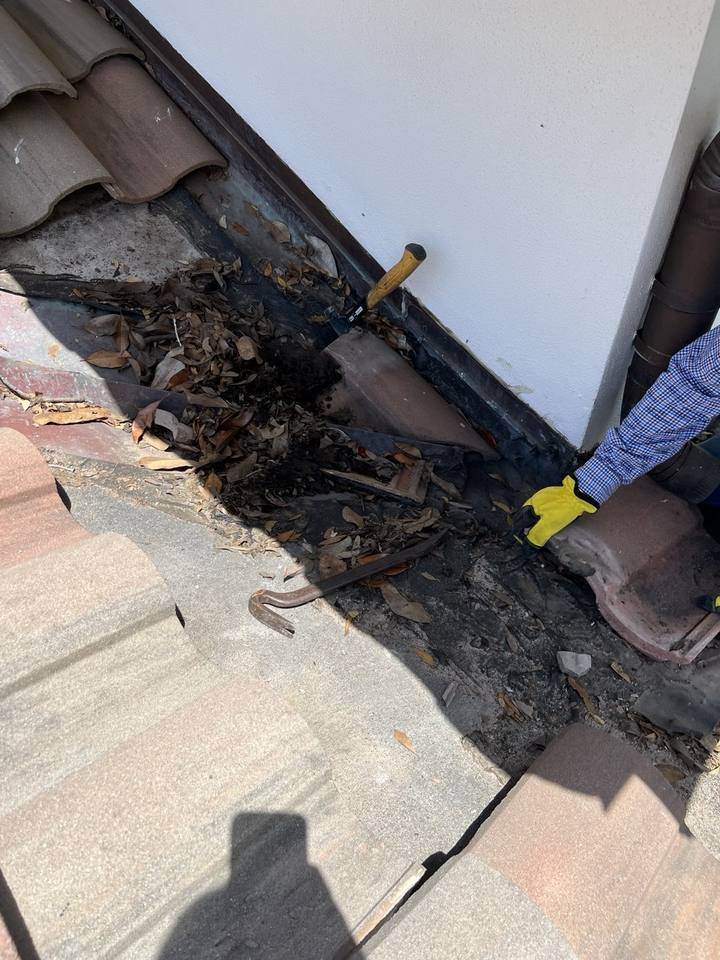 Roof repair work in progress on a residential roof