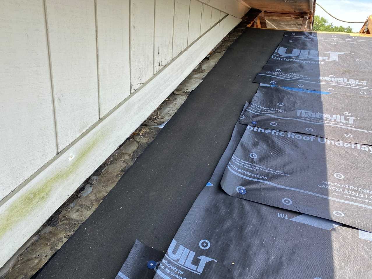 Roof-to-wall dry-in detail with self-adhered underlayment